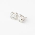 J&Y Foglia Moissanite stud earrings with leaf design, featuring sparkling moissanite gemstones on silver-colored metal setting