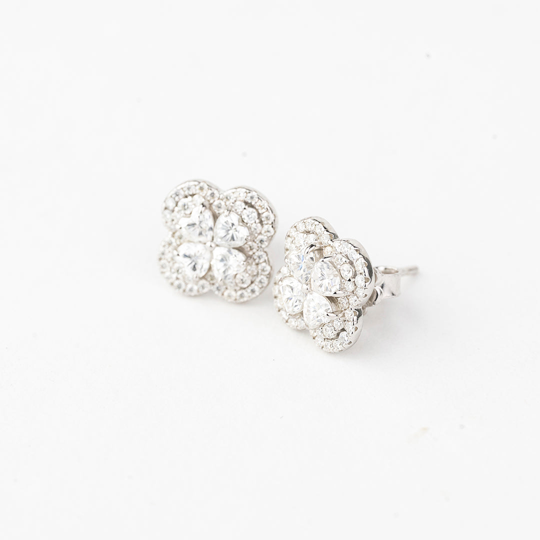 J&Y Foglia Moissanite stud earrings with leaf design, featuring sparkling moissanite gemstones on silver-colored metal setting