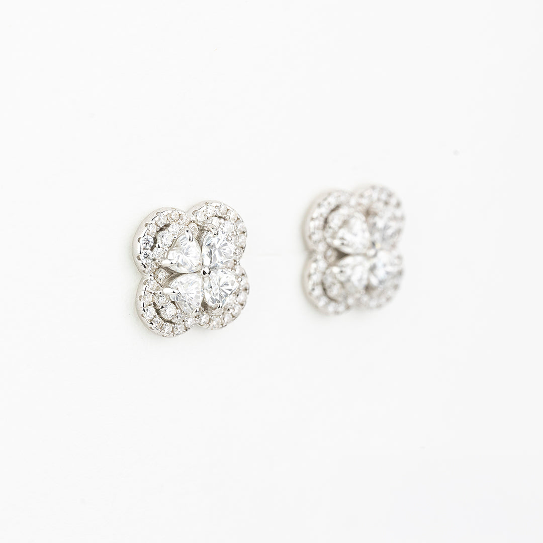 J&Y Foglia Moissanite stud earrings featuring leaf-shaped design with sparkling moissanite gemstones on a silver setting.