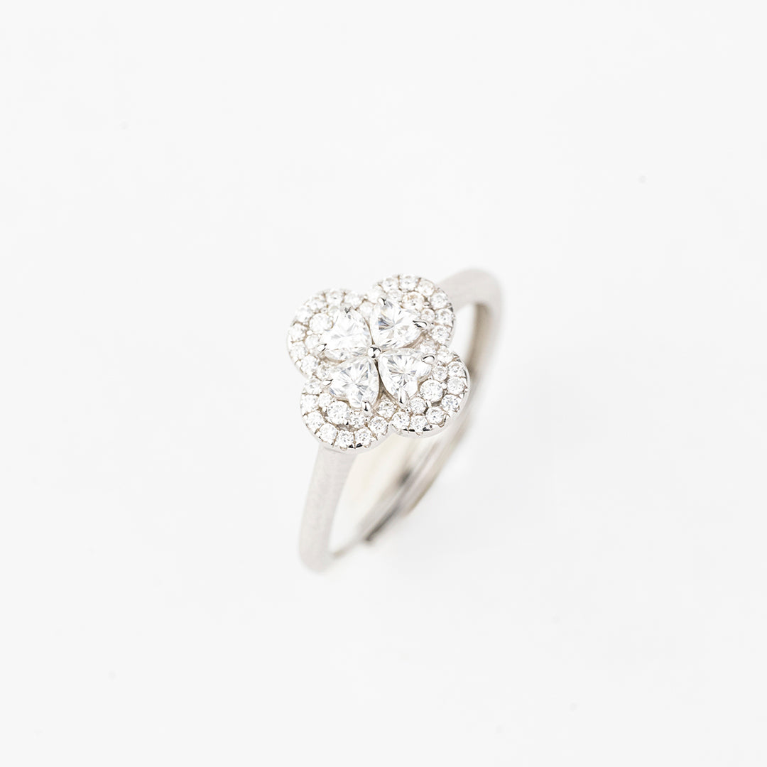 J&Y Foglia Moissanite ring with a delicate band and sparkling moissanite stone, close-up view of the elegant jewelry piece