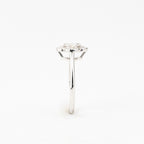 J&Y Foglia Moissanite Ring featuring a delicate band with a sparkling moissanite gemstone centerpiece.