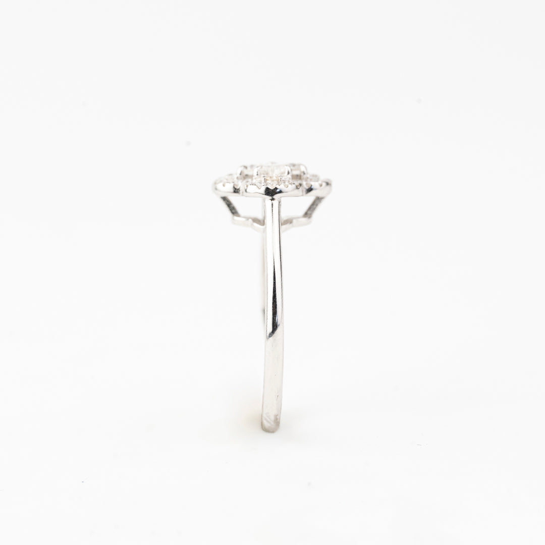 J&Y Foglia Moissanite Ring featuring a delicate band with a sparkling moissanite gemstone centerpiece.