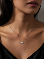 Elegant J&Y Moissanite necklace featuring a sparkling gemstone pendant on a delicate chain.